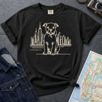 Black Comfort Colors t-shirt with a Pitbull dog and cityscape design on a gray surface with a denim jacket and map.