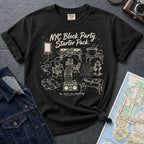 Black Comfort Colors T-shirt with off-white NYC Block Party Starter Pack front print, styled with denim jacket, camera, and subway map