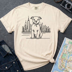Ivory Comfort Colors t-shirt with a Pitbull dog and cityscape design on a gray surface with a denim jacket and map.