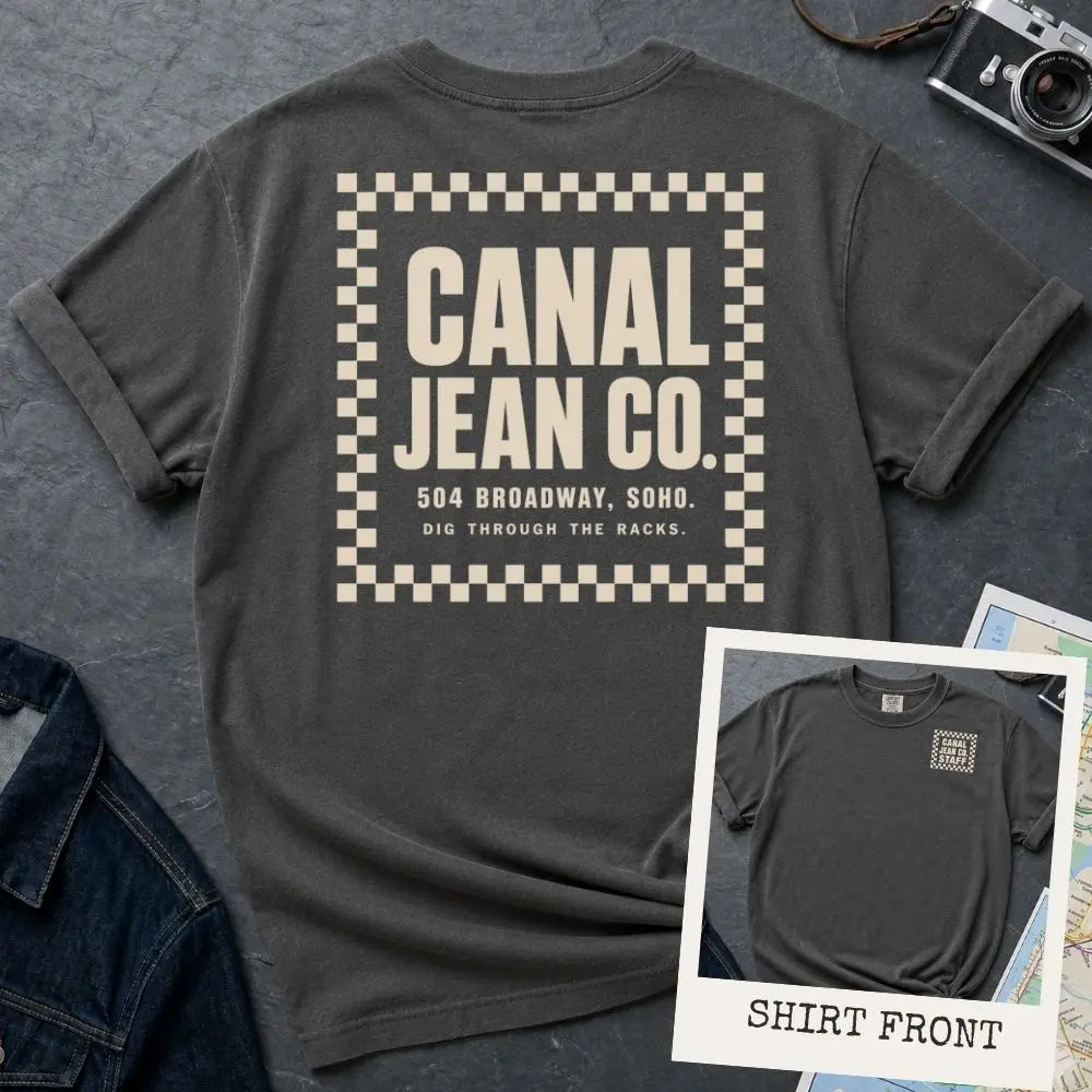Pepper-colored Comfort Colors T-shirt with off-white Canal Jean Co. NYC back print and small front chest staff print, shown as a double-sided New York nostalgia tee