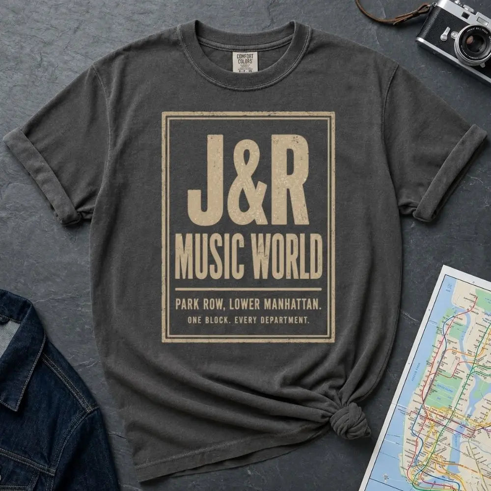 Pepper-colored Comfort Colors T-shirt with off-white J&R Music World NYC front print, styled with denim jacket, camera, and subway map