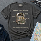 Pepper colored Comfort Colors t-shirt with a vintage jukebox graphic and text on a dark surface with a denim jacket and a map.