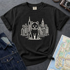 Black Comfort Colors t-shirt featuring a minimalist Shiba Inu graphic in front of the New York City skyline.