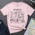 Pink Comfort Colors t-shirt featuring an 80’s NYC Kid Starter Pack graphic with hand-drawn New York City icons including Italian ice, a radio, stoop steps, stickball, a fire hydrant, and a pigeon.