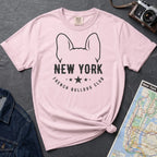 Pink Comfort Colors t-shirt featuring a New York French Bulldog Club graphic with bold text, outlined French bulldog ears, stars, and a minimalist black design.