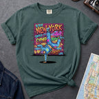 Blue spruce Comfort Colors t-shirt featuring a colorful B-Boy New York graphic with a breakdancer in front of a graffiti brick wall.