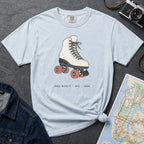 Light blue Comfort Colors t-shirt featuring a vintage roller skate graphic with “Roll With It • NYC • 1988” text.