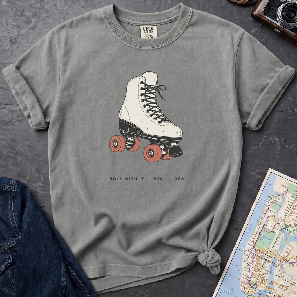 Granite colored Comfort Colors t-shirt featuring a vintage roller skate graphic with “Roll With It • NYC • 1988” text.