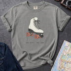 Granite colored Comfort Colors t-shirt featuring a vintage roller skate graphic with “Roll With It • NYC • 1988” text.