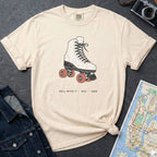 Ivory Comfort Colors t-shirt featuring a vintage roller skate graphic with “Roll With It • NYC • 1988” text.