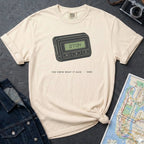 Ivory Comfort Colors t-shirt featuring a retro pager graphic with “07734” on the screen and “You knew what it said • 1989” text.