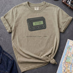 Khaki colored Comfort Colors t-shirt featuring a retro pager graphic with “07734” on the screen and “You knew what it said • 1989” text.