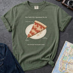 Moss green Comfort Colors t-shirt featuring a vintage New York City dollar slice pizza graphic with specimen-style callouts and a folded slice on a paper plate.