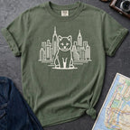 Moss green Comfort Colors t-shirt featuring a minimalist Shiba Inu graphic in front of the New York City skyline.