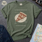 Moss Green Comfort Colors t-shirt featuring a vintage New York City dollar slice pizza graphic with specimen-style callouts and a folded slice on a paper plate.