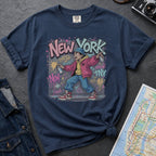 Navy Comfort Colors t-shirt featuring a colorful NYC graffiti-style New York graphic with a young street artist holding a spray paint can