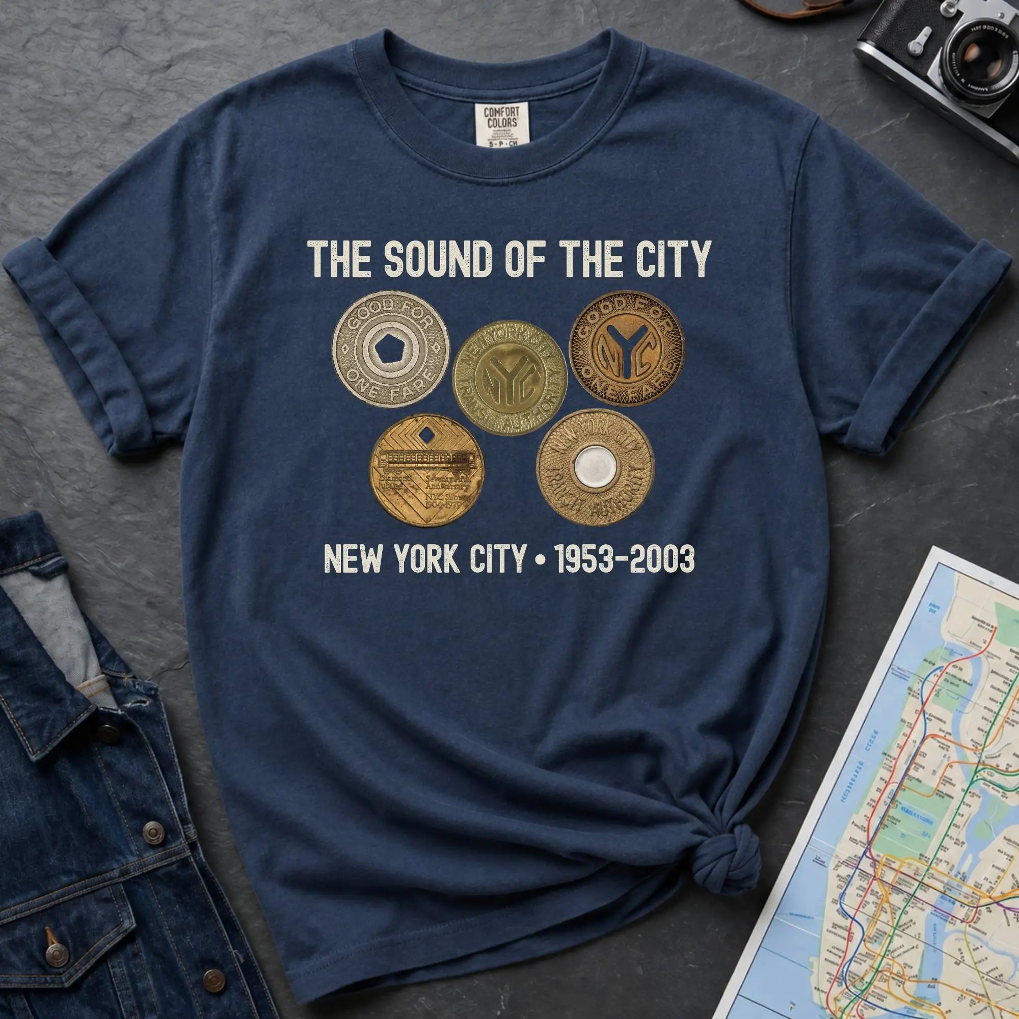 Navy Comfort Colors t-shirt featuring vintage New York City subway tokens with “The Sound of the City” and “New York City • 1953–2003” text.