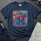 Navy Comfort Colors t-shirt featuring a colorful NYC graffiti-style New York graphic with a young street artist holding a spray paint can