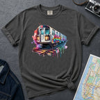 Pepper colored Comfort Colors t-shirt featuring a colorful NYC subway train graphic with graffiti-style paint details and bright street art accents.