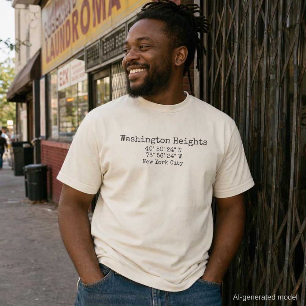 Man wearing an Ivory Comfort Colors t-shirt with 'Washington Heights' coordinates, standing on a street.