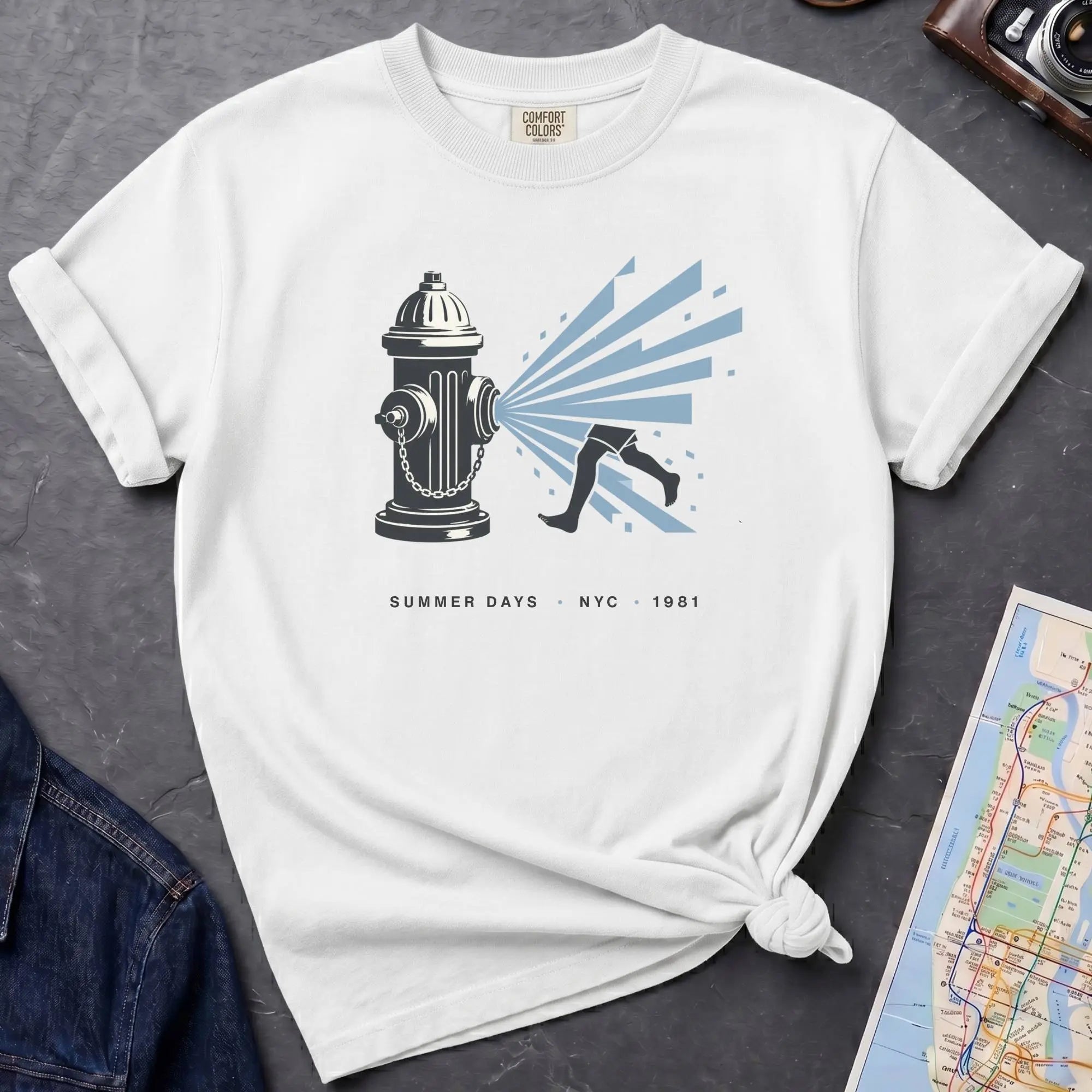 White Comfort Colors t-shirt featuring a vintage NYC fire hydrant spraying water with “Summer Days • NYC • 1981” text.