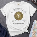 White Comfort Colors t-shirt featuring a vintage New York City subway token graphic with specimen-style callouts and “You felt it before you used it” text.