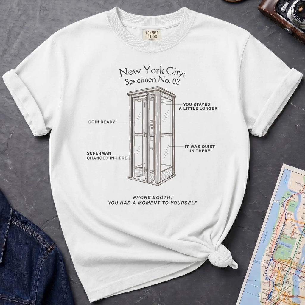 White Comfort Colors t-shirt featuring a vintage New York City phone booth graphic with specimen-style callouts and “Phone Booth: You Had a Moment to Yourself” text.