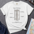 White Comfort Colors t-shirt featuring a vintage New York City phone booth graphic with specimen-style callouts and “Phone Booth: You Had a Moment to Yourself” text.