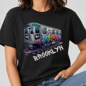Black t-shirt with a graffiti-covered NYC subway train on tracks and Brooklyn in white hand-painted letters.