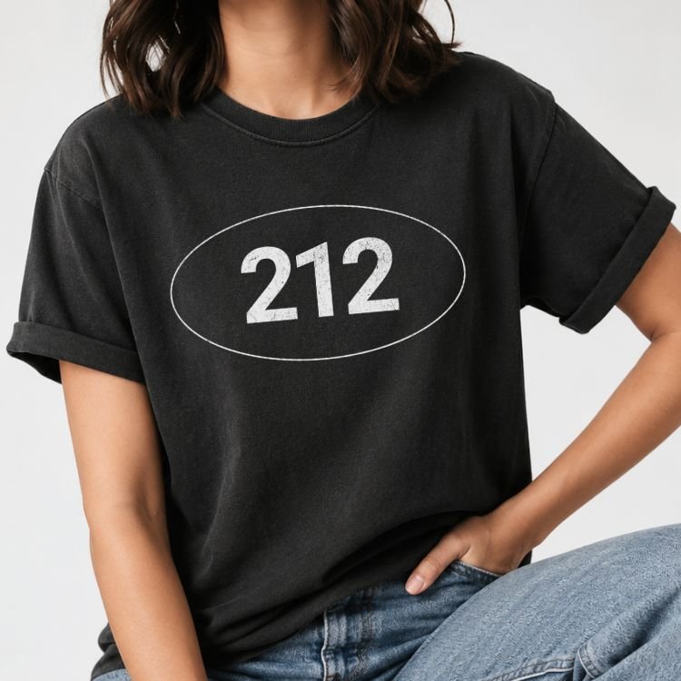 Black t-shirt with the NYC 212 area code in distressed numbers inside a thin oval sticker design