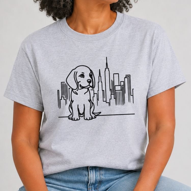 Heather grey t-shirt with black line art of a beagle puppy sitting in front of the NYC skyline and Empire State Building