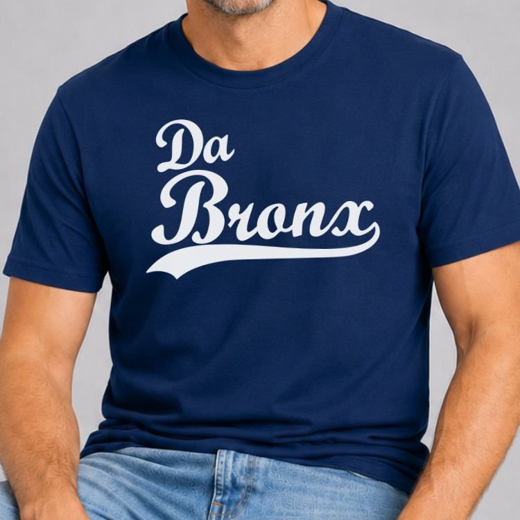 Navy t-shirt with Da Bronx in white vintage baseball script lettering with a swoosh tail underline